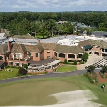 Aqua-Nomics provides professional roof cleaning for country clubs, HOAs, and hotels using soft wash to safely remove stains, algae, and mold