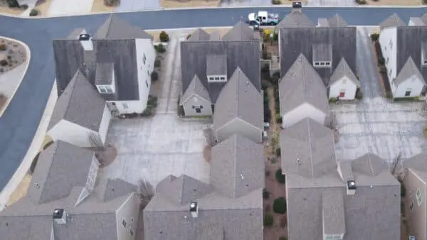 Discover how Aqua-Nomics safely removes algae, mold, and streaks from shingle roofs, protecting your home and enhancing curb appeal with expert roof cleaning