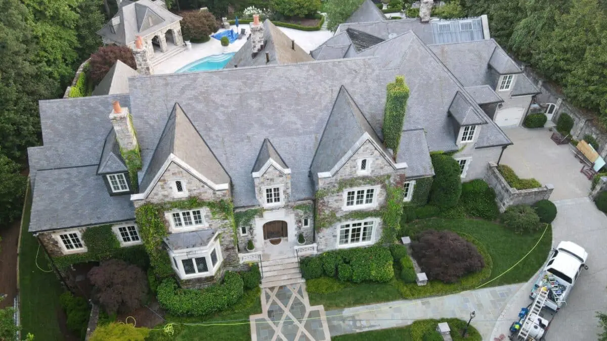 Learn key facts about residential roof cleaning—why it's necessary, how it's done, and how Aqua-Nomics helps extend your roof’s life with expert care