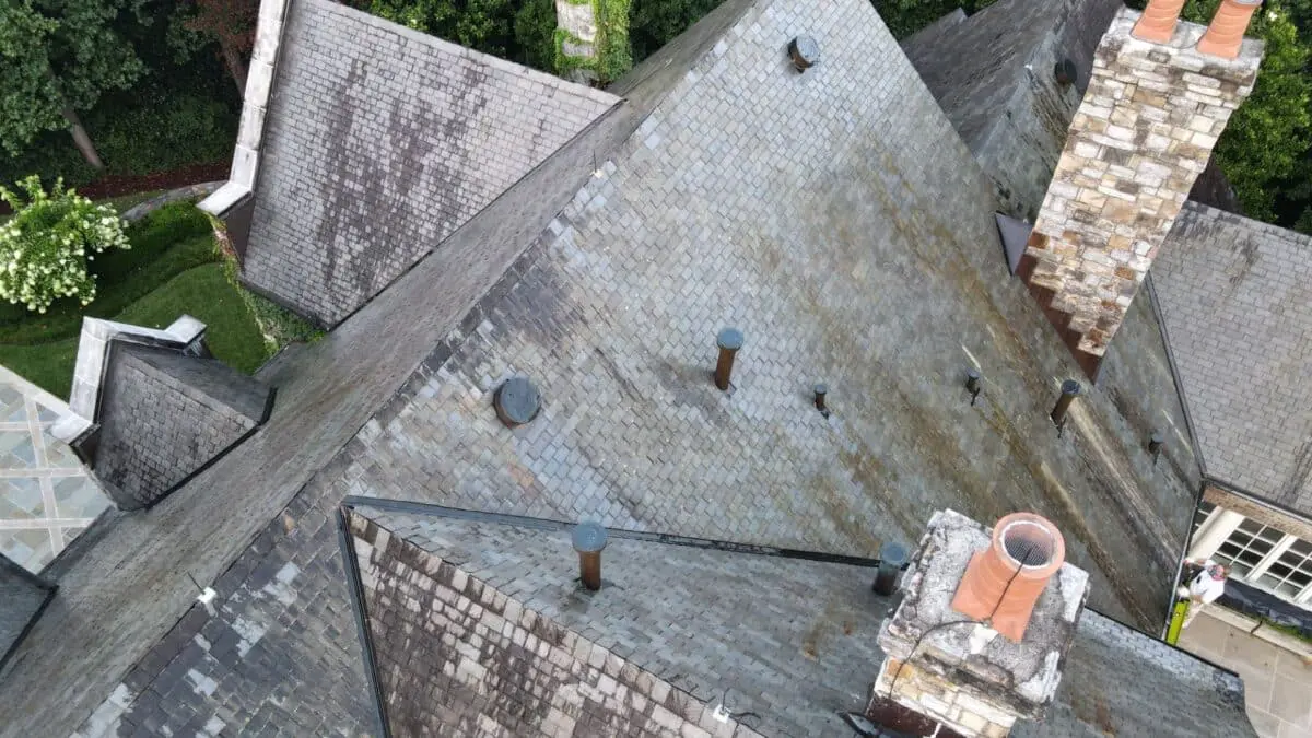 Discover how soft washing removes black streaks on roofs and protects shingles from damage with a gentle yet effective cleaning method