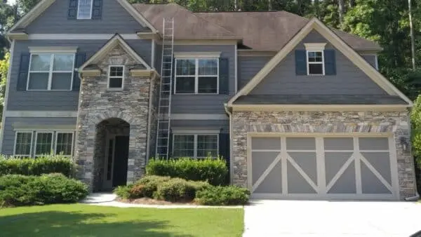 Clean siding and stone accents showcase how power washing enhances curb appeal and contributes to a higher property value in real estate markets