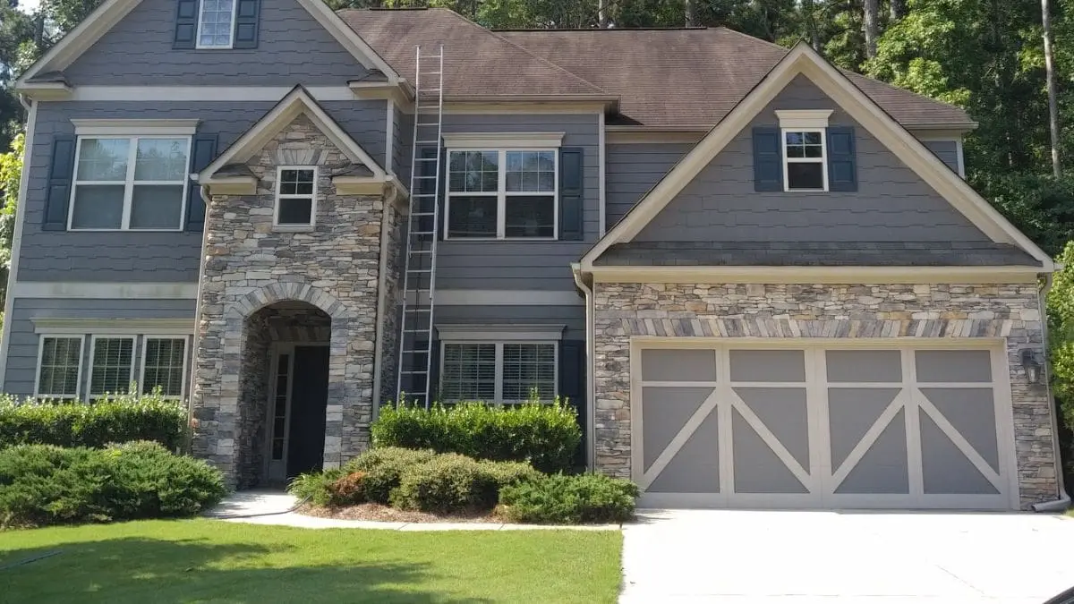 Clean siding and stone accents showcase how power washing enhances curb appeal and contributes to a higher property value in real estate markets