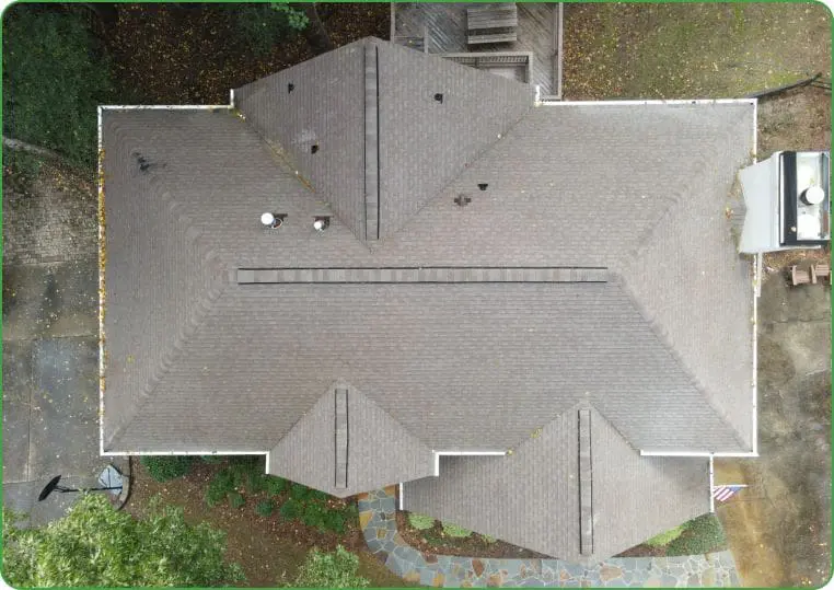 Drone View of Clean Residential Roof Aerial photo of a spotless residential roof, ideal for highlighting soft wash cleaning results or roof inspection services with professional care