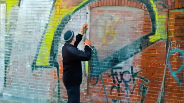 Discover the best techniques to remove graffiti from brick and concrete using pressure washing without damaging surfaces or leaving residue