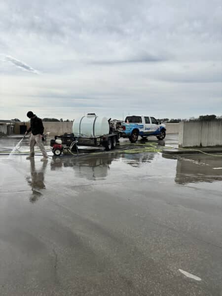 An Aqua Nomics Professional Doing Pressure Washing